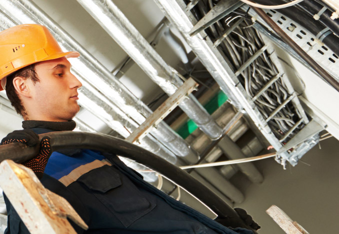 Workers installing electrical cables