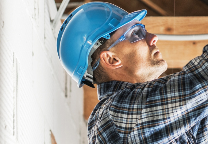 Electrician wearing blue hard hat